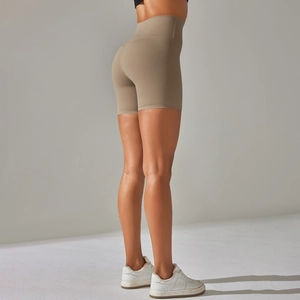 Detailed back view of high-waisted khaki yoga shorts with seamless peach lift effect