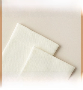 Detail of high-elasticity ribbed cuff on white combed cotton socks for ankle comfort