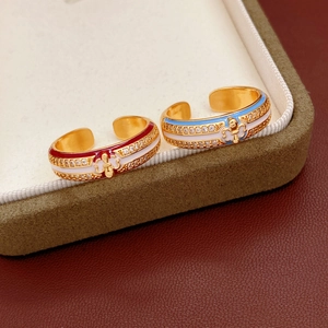 Detailed view of the vintage 18k gold plated ring with colorful enamel and zircon stones
