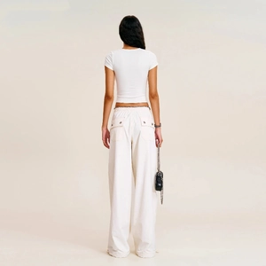 Back view of white high-waisted wide-leg cargo pants and slim fit t-shirt on a model