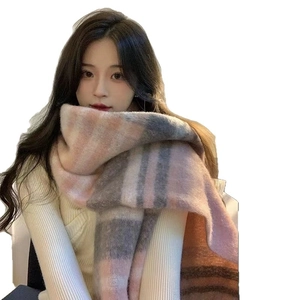 Cozy pink and grey plaid mohair scarf for women with soft tassels on a white background