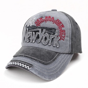 Detail of washed grey baseball cap featuring vintage embroidery and NewYork denim patch