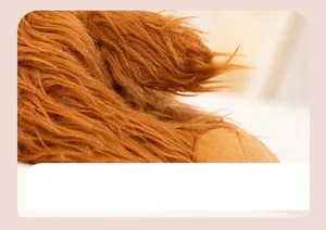 Close-up of the long brown plush fur texture and full filling of the highland cow toy