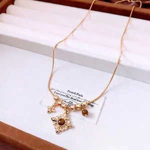 Vintage tiger eye stone beaded necklace with cross flower pendant in golden finish