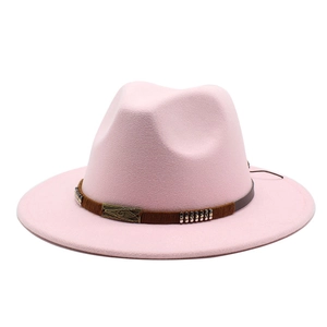 Detail of pink fedora wool hat with brown studded band and vintage metal buckle