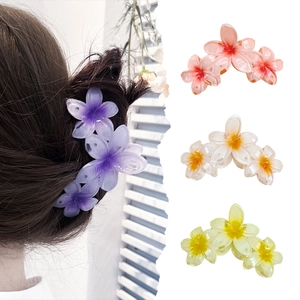 Large tropical frangipani flower hair claws in purple, pink, white and yellow colors