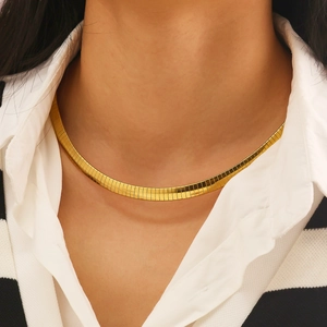 Close-up of a 18k gold plated flat snake chain necklace worn on a woman's neck
