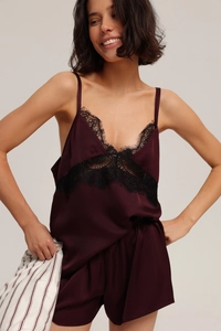 Detail of burgundy satin pajama set with black eyelash lace trim and V-neckline