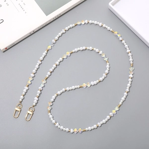 Crossbody phone chain with white irregular pearls, colorful crystals, and gold lobster clasps