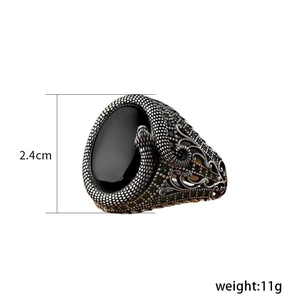 Detailed view of vintage serpent ring with black stone and 2.4cm height measurement