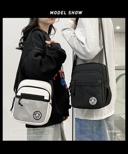 Side view of black and beige casual crossbody bags with mesh pockets and dual zippers