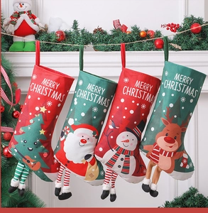 Detail of Christmas stockings with 3D dangling legs hung on a festive fireplace