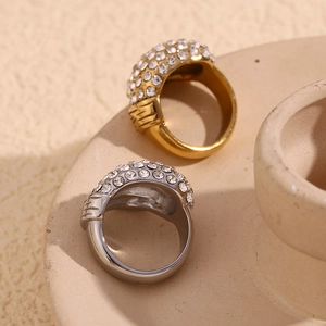 Close-up of gold and silver plated stainless steel rings with full crystal pavé inlay