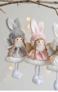Detailed view of plush angel rabbit hanging ornaments in grey, pink, and white colors