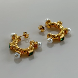 Vintage gold C-shaped earrings with textured pattern, white pearls and emerald gemstones