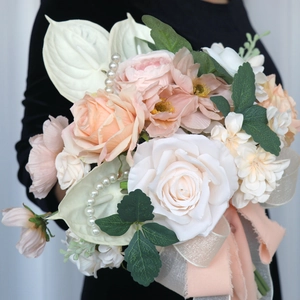 Elegant bridal bouquet with cream roses, pearls and ribbons for western weddings