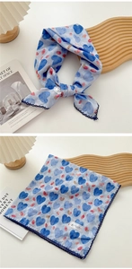 Light blue heart print square scarf with delicate navy lace trim shown flat and knotted