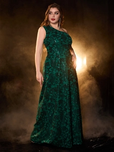 Detail of dark green sequin embroidery on an elegant one-shoulder formal evening gown