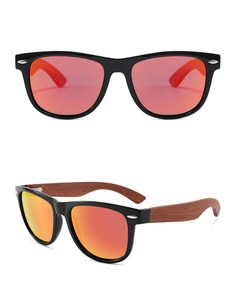 Macro detail of oval sunglasses with wood temples and orange reflective lenses