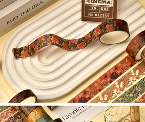 Detail showing vintage floral washi tape with artistic prints in brown and green tones
