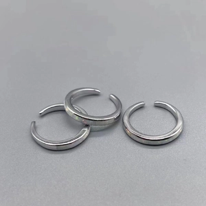 Three S925 sterling silver open rings for toes with opal inlay on gray background