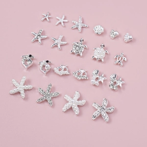 Silver ocean nail charms with shells, starfish, and pearls for DIY manicure art