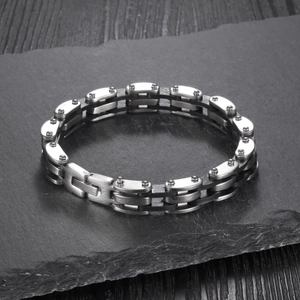 Detail shot of vintage multi-layer silicone and stainless steel bracelet on stone background