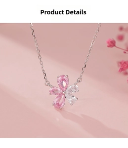 Detail showing a five-petal flower pendant with pink and white pear-cut zircons