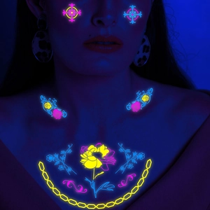 Neon UV reactive floral temporary tattoo set for arms and chest on female model