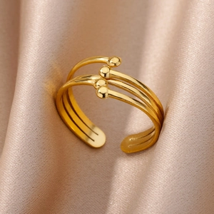 Close-up of triple-layered 18k gold plated stainless steel open ring with metal beads
