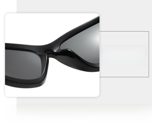 Detail view of the integrated nose pad design on black wrap-around cycling sunglasses