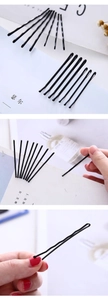 Detail of matte black metal hairpins in straight and wavy styles for hair styling