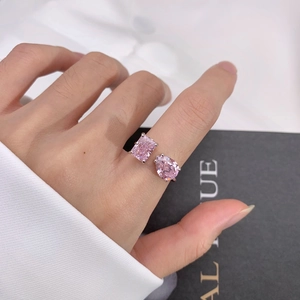 Detail of S925 silver open ring with pear and radiant cut pink stones on hand