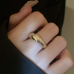 Macro detail of 18K gold plated double layer ring with sparkling cubic zirconia pavé