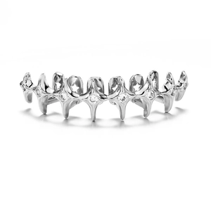 Macro shot of silver hip-hop grillz featuring star shapes and paved zircon stones