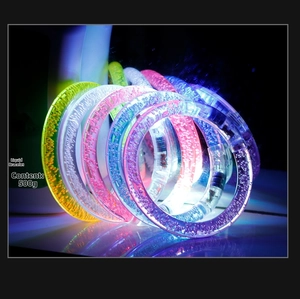 Close-up of vibrant LED glowing bubble bracelets in various colors for night parties
