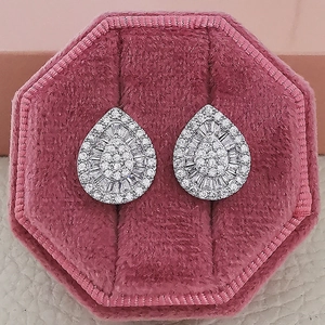 Sparkling pink pear-cut zircon teardrop earrings in a pink velvet jewelry box