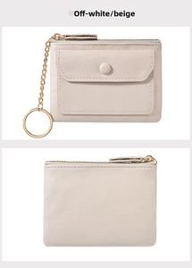 Close-up of beige leather mini wallet with front snap pocket and gold keychain link