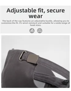 Detailed view of adjustable metal buckle and cotton fabric on dark grey baseball cap