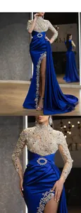 Detail of royal blue evening gown featuring intricate silver lace and high side slit