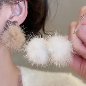 Elegant plush pom pom pearl earrings in white and beige for autumn winter fashion