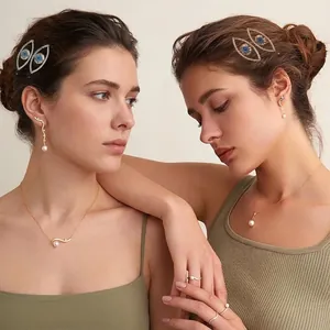 Punk style evil eye hair clip with sparkling rhinestones for women shown on models