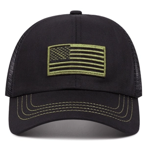 Detail of black trucker hat featuring olive green American flag embroidery and mesh back