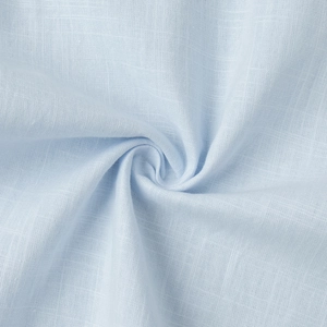 Macro shot of light blue cotton fabric texture with spiral drape and weave detail
