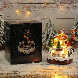 Dekoratives leuchtendes Weihnachts-Spieluhrhaus mit warmen LEDs und Geschenkverpackung.