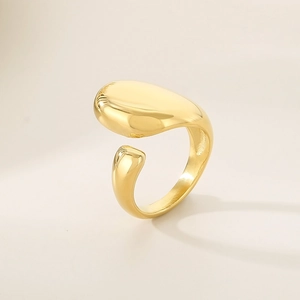 Detailed view of polished 18K gold irregular open ring with glossy metallic finish
