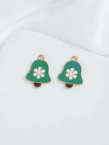 Detail of green enamel Christmas bell charms with white snowflake pattern for DIY jewelry