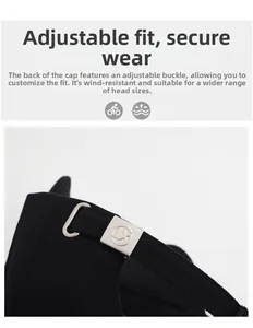 Détail de la boucle en métal réglable et du coton sergé sur la casquette de baseball noire