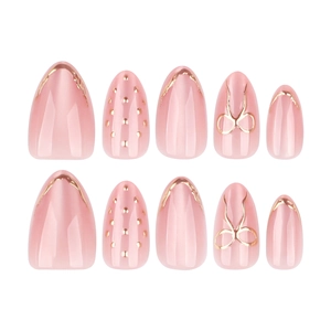 Faux ongles amande rose nude avec nœuds dorés et design œil de chat scintillant
