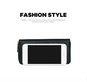 Detail of black pebbled PU leather long wallet with gold zipper next to a smartphone